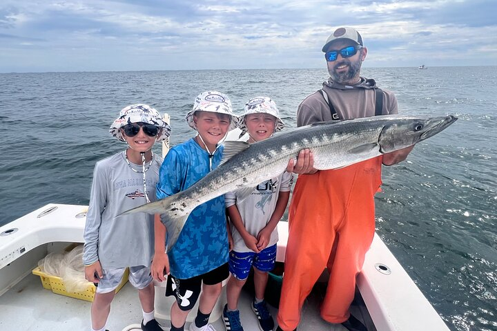 Kids with a late summer barracuda off Anna Maria Island